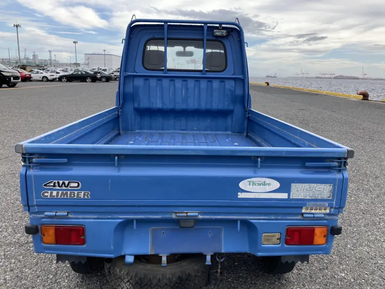 Tailgate of a blue Daihatsu Hijet Kei Truck with the 4WD Climber badge