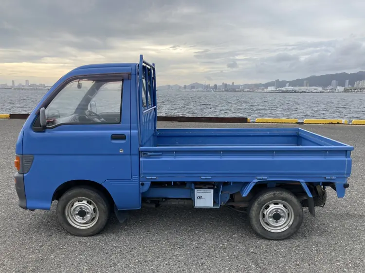 Side profile of a blue Daihatsu Hijet S110P 4WD Kei Truck